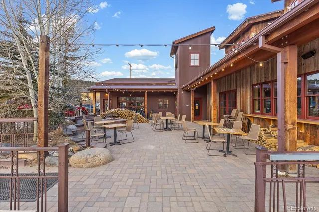 a view of a building with sitting area
