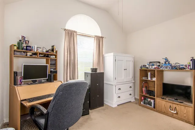 a view of livingroom with furniture flat screen tv and windows
