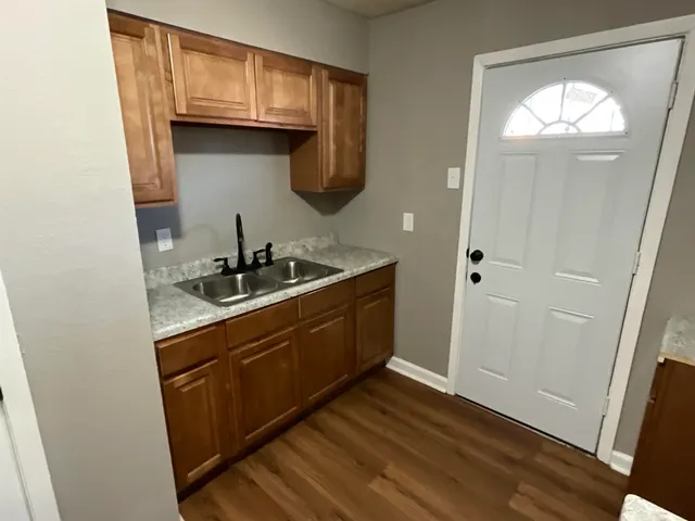 a kitchen with a sink and cabinets