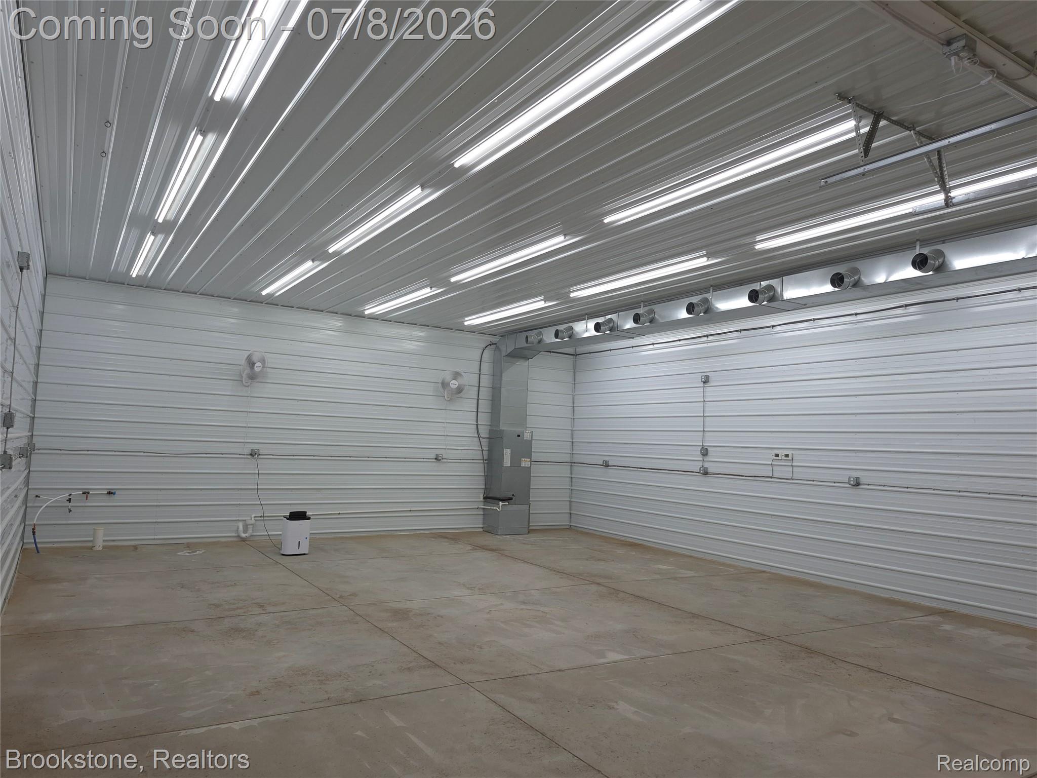 4140 South Henderson Road Davison, MI 48423 - Photo 13 of 98 Spacious interior featuring corrugated metal walls and ceiling