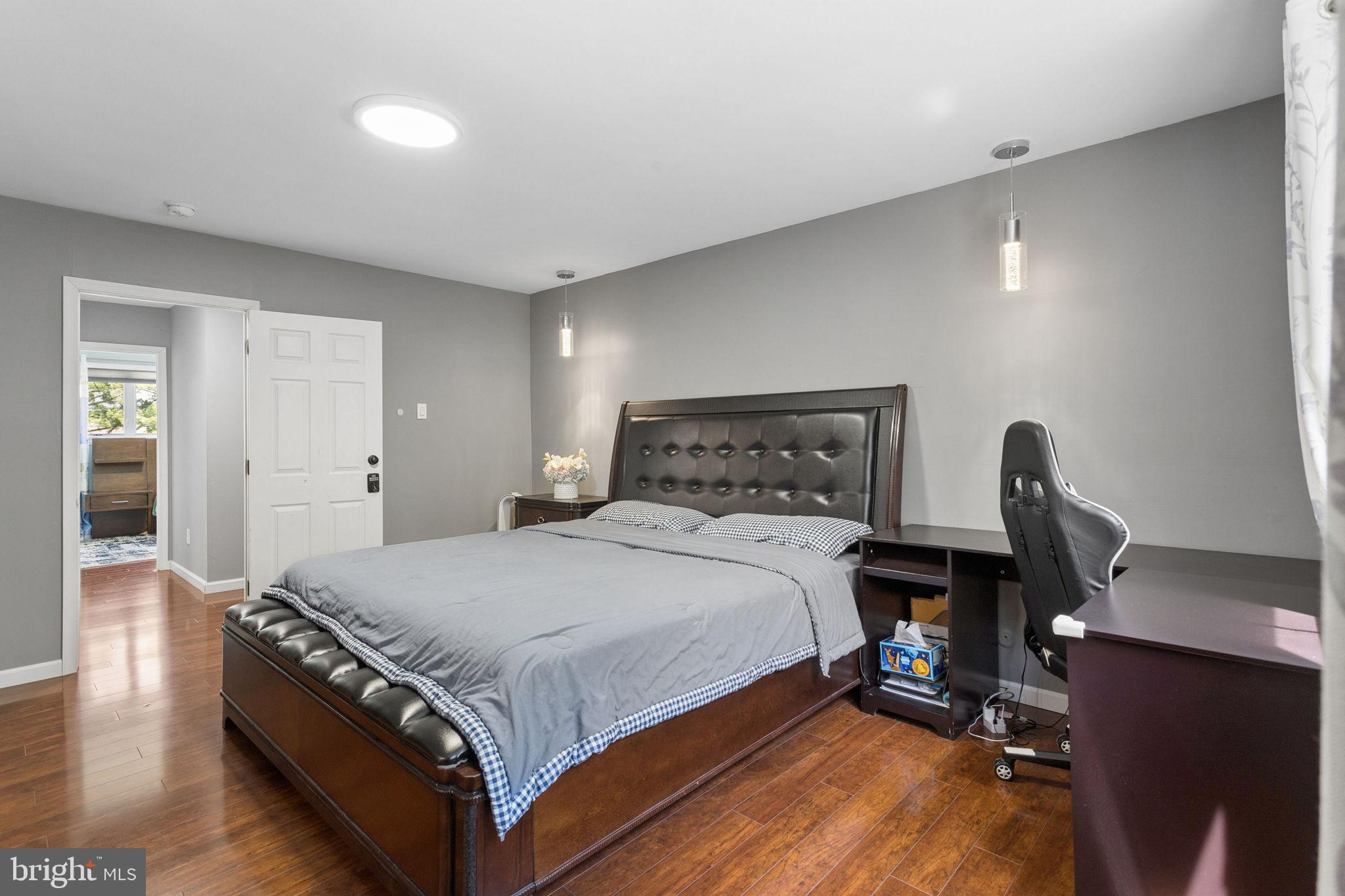 252 Sandringham Road Cherry Hill, NJ 08003 - Photo 16 of 31 a bedroom with a bed and wooden floor