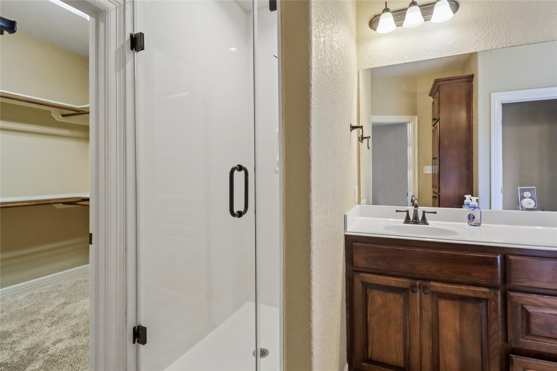1012 Rosewood Lane Angleton, TX 77515 - Photo 18 of 21 a bathroom with a sink and mirror