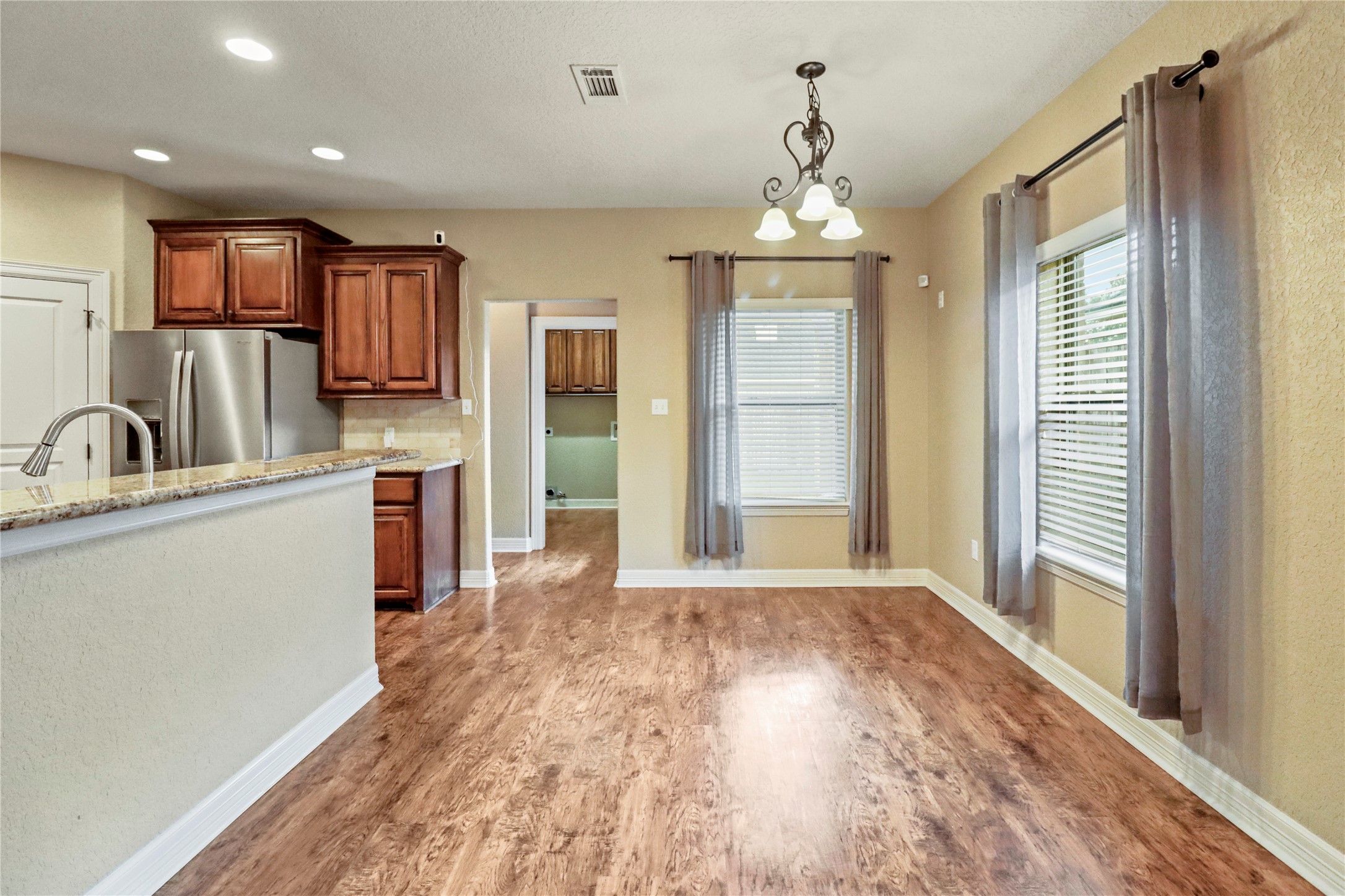 1012 Rosewood Lane Angleton, TX 77515 - Photo 9 of 21 a view of a kitchen with a sink dishwasher and a refrigerator