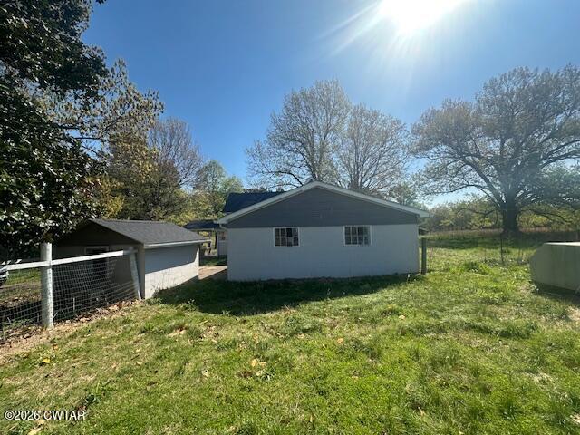450 Kenny Road Martin, TN 38237 - Photo 4 of 17 a house with trees in the background