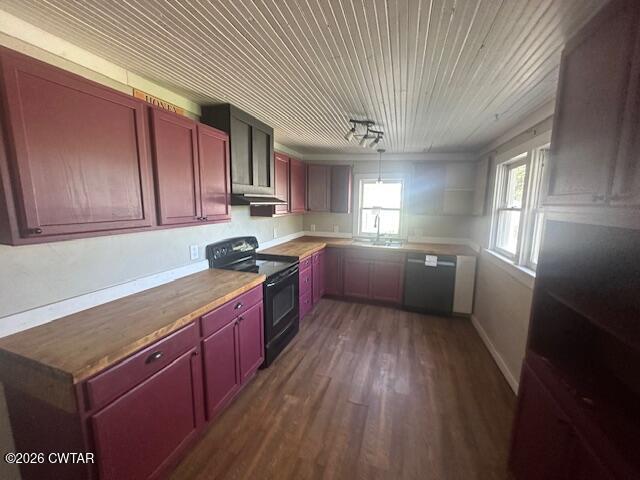 450 Kenny Road Martin, TN 38237 - Photo 6 of 17 a kitchen with stainless steel appliances granite countertop a sink a stove a refrigerator cabinets and wooden floor