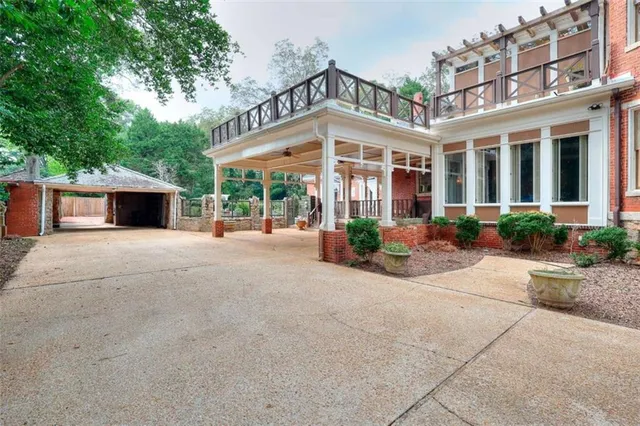 a lobby with furniture and a chandelier