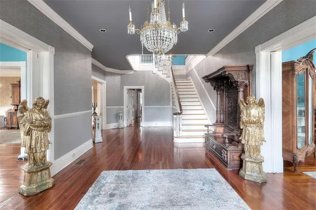 a spacious bedroom with a bed and a window