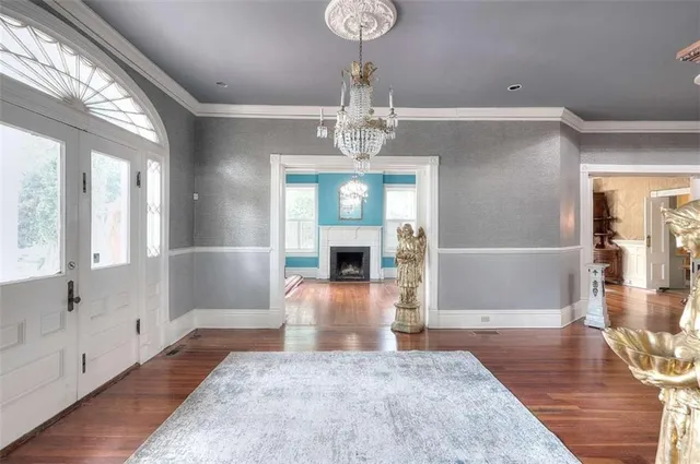 a kitchen with stainless steel appliances a kitchen island a stove a table and chairs in it