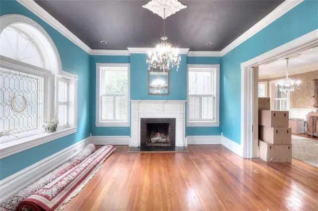 a kitchen with stainless steel appliances a table chairs and a window