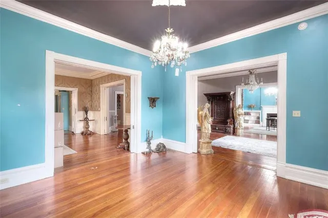 a living room with fireplace furniture and a wooden floor