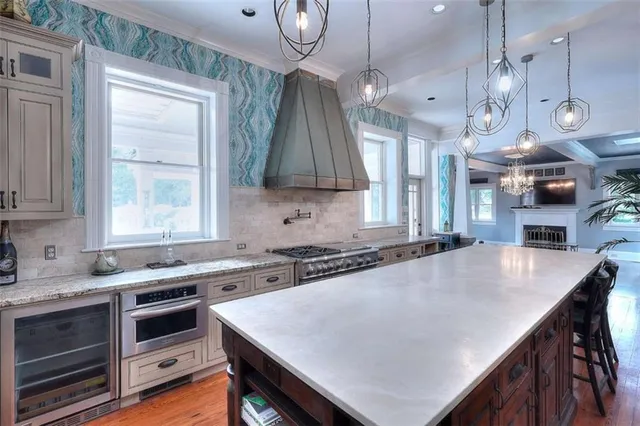 a very nice looking room with wooden floor and a large window