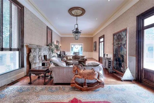 a spacious bedroom with a bed and a flat screen tv