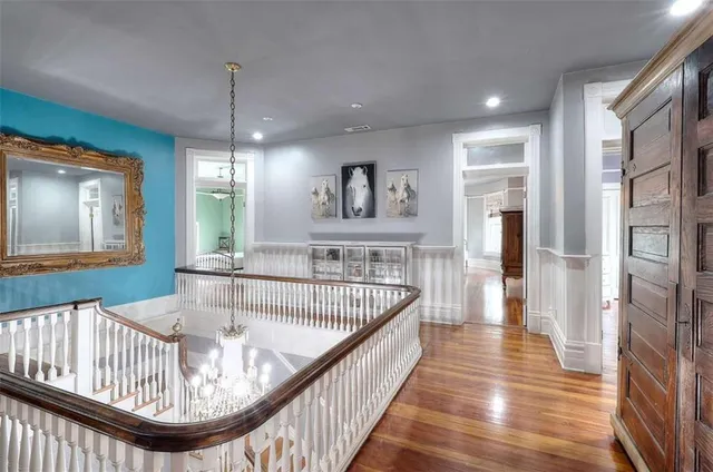 a bathroom with a granite countertop sink a toilet and a mirror
