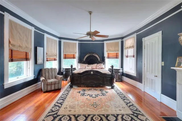 a front view of a house with a garden and swimming pool