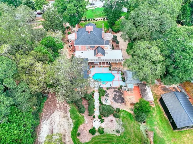 a view of a chairs and tables in the back yard