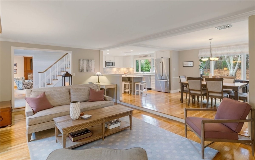 50 Stonecleave Road Boxford, MA 01921 - Photo 11 of 42 a living room with furniture a table and kitchen view