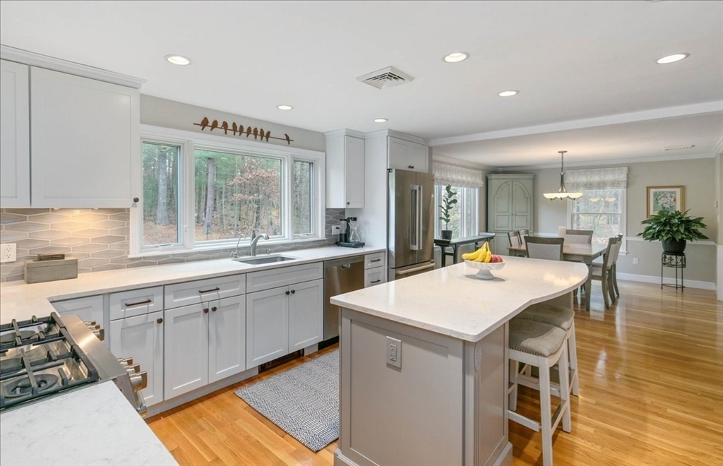 50 Stonecleave Road Boxford, MA 01921 - Photo 14 of 42 a kitchen with a sink stove and cabinets