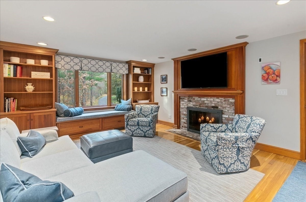 50 Stonecleave Road Boxford, MA 01921 - Photo 18 of 42 a living room with furniture fireplace and flat screen tv