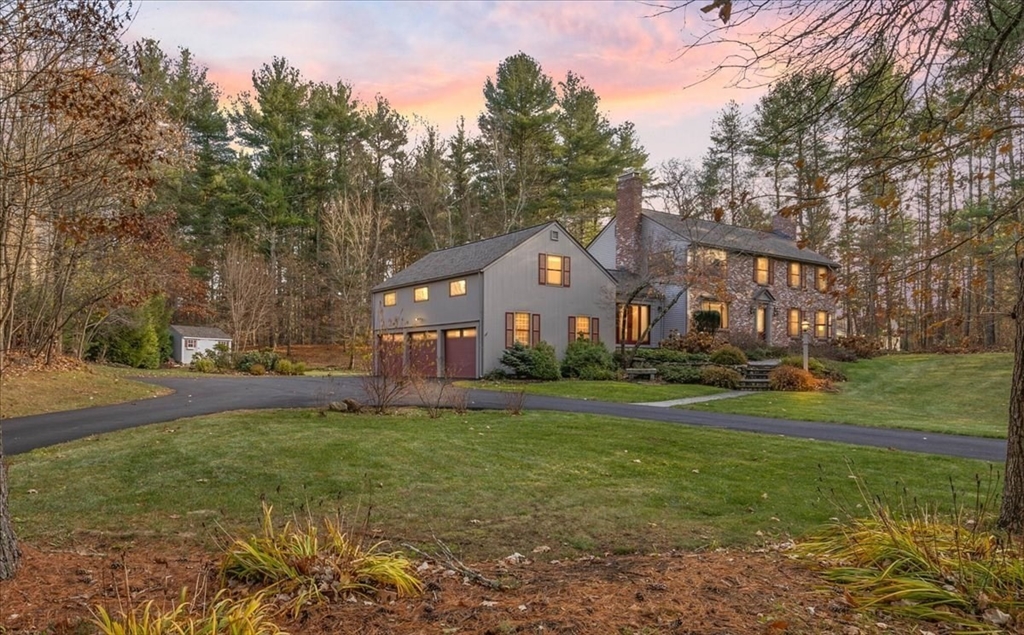 50 Stonecleave Road Boxford, MA 01921 - Photo 2 of 42 a front view of a house with a yard and trees