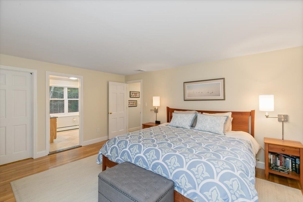50 Stonecleave Road Boxford, MA 01921 - Photo 24 of 42 a bedroom with a large bed and a window