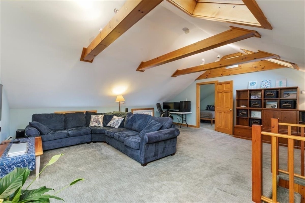 50 Stonecleave Road Boxford, MA 01921 - Photo 33 of 42 a living room with furniture a ceiling fan and a rug