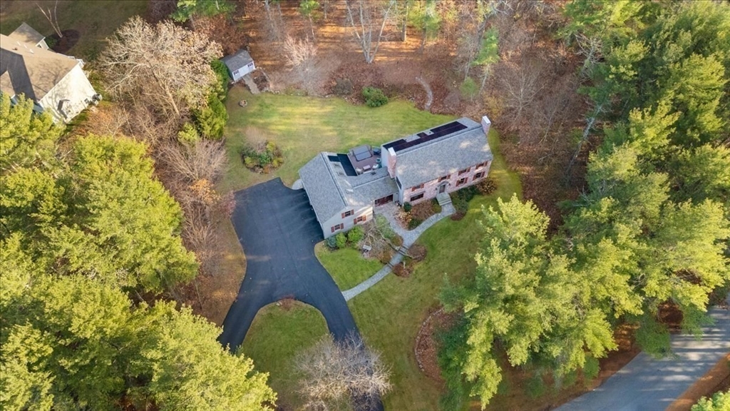 50 Stonecleave Road Boxford, MA 01921 - Photo 41 of 42 an aerial view of a house with a yard and large trees