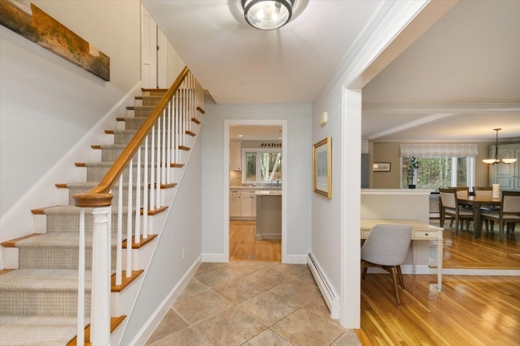 50 Stonecleave Road Boxford, MA 01921 - Photo 7 of 42 a view of entryway dining room and hall with wooden floor