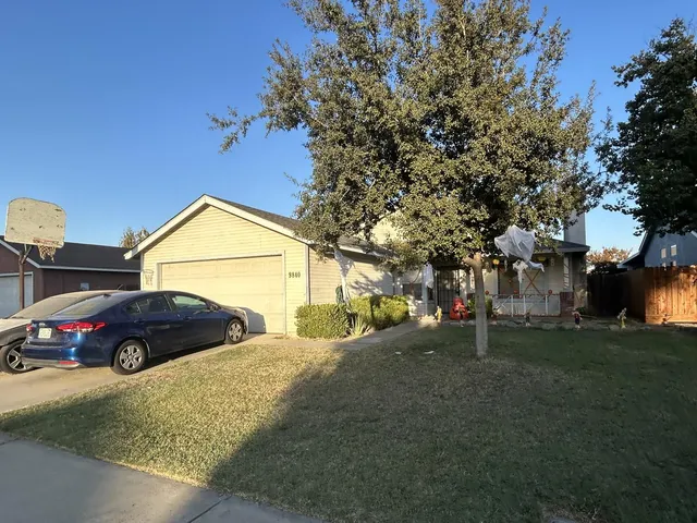 a view of street with parked cars
