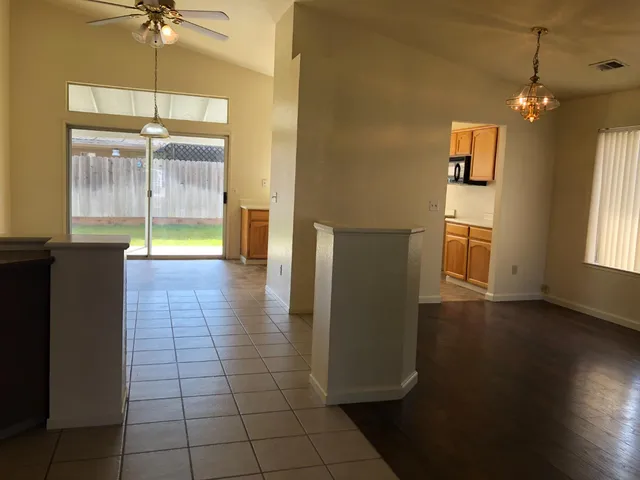 a view of a hallway with a chandelier