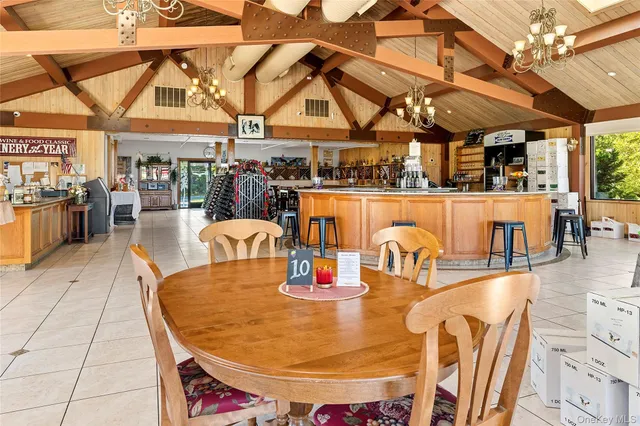 a dining room with lots of wooden furniture