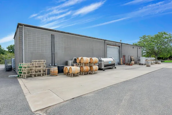 a view of a patio with furniture and a fire pit