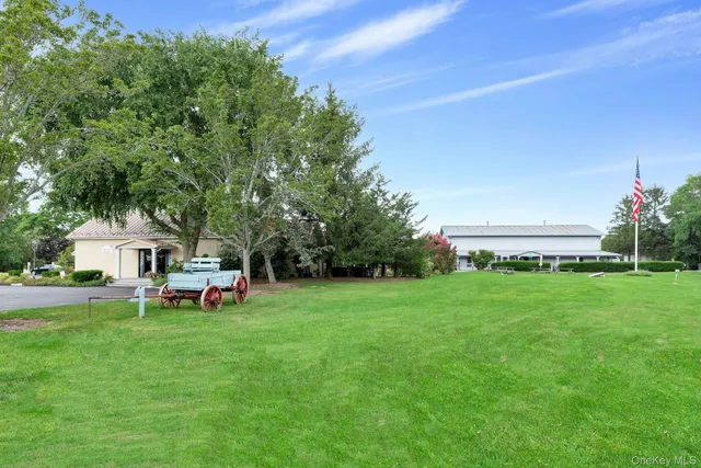 a view of a house with a yard porch and sitting area