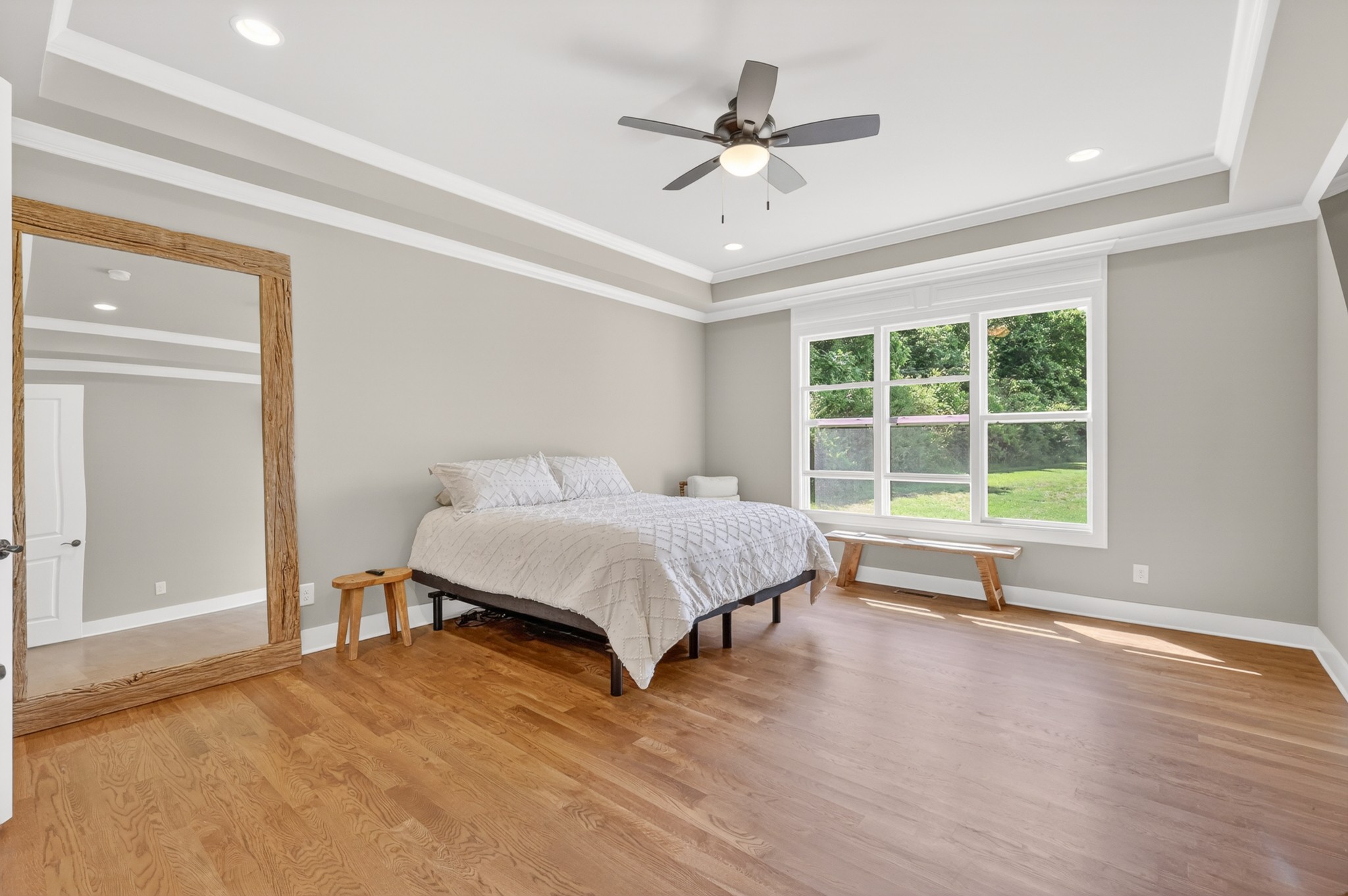 1176 Iron Bridge Road Columbia, TN 38401 - Photo 27 of 53 a spacious bedroom with a large bed and a chandelier