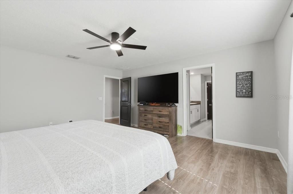 2175 Old Mining Road Lakeland, FL 33801 - Photo 19 of 51 a bedroom with a bed and a flat screen tv