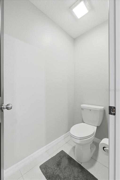 2175 Old Mining Road Lakeland, FL 33801 - Photo 22 of 51 a white toilet sitting next to a shower