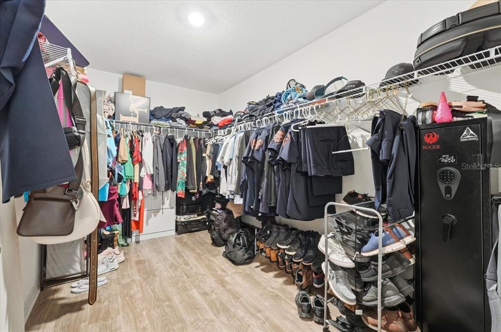 2175 Old Mining Road Lakeland, FL 33801 - Photo 23 of 51 a view of walk in closet with clothes