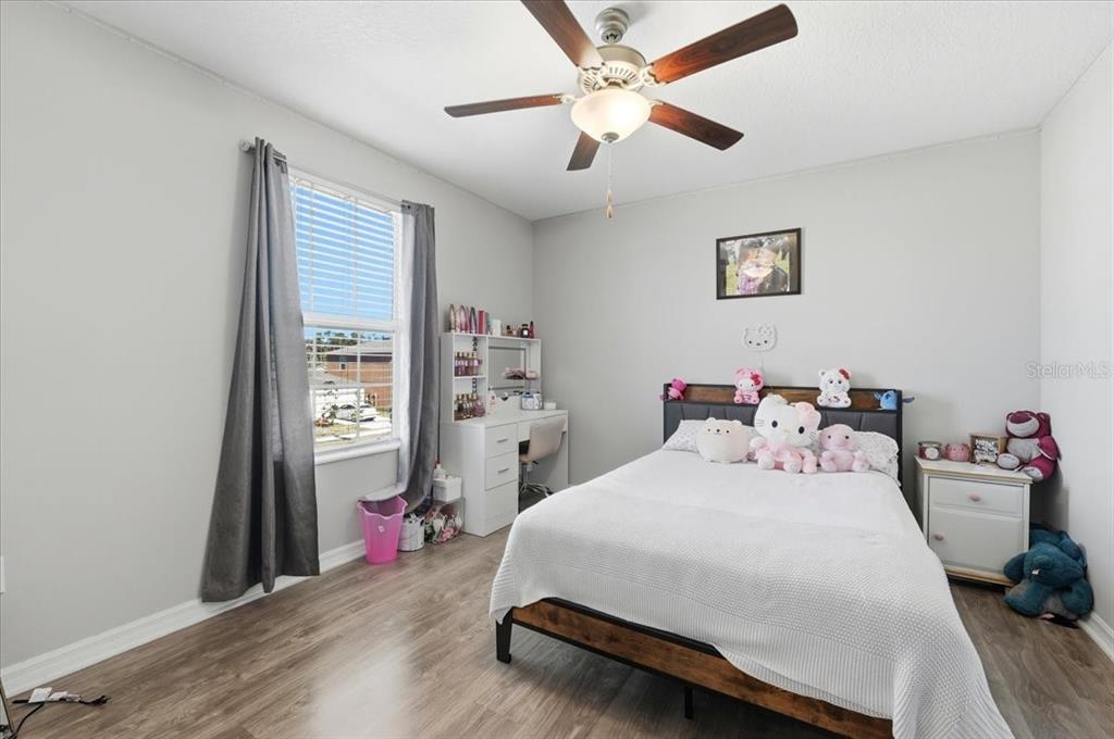 2175 Old Mining Road Lakeland, FL 33801 - Photo 24 of 51 a bedroom with a bed chandelier and a window