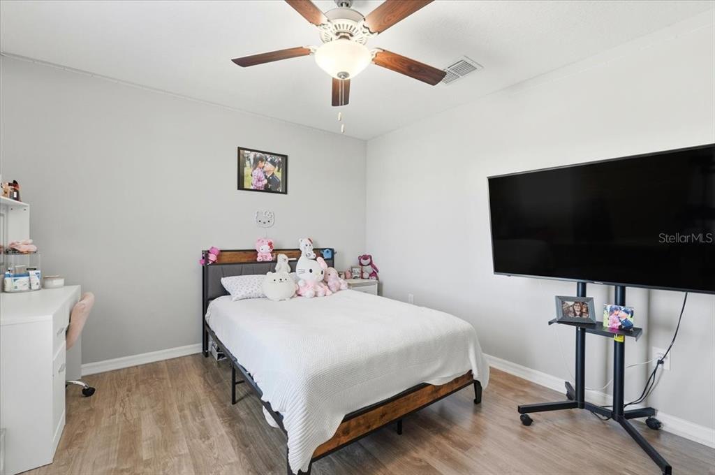 2175 Old Mining Road Lakeland, FL 33801 - Photo 25 of 51 a bedroom with a bed and a flat screen tv