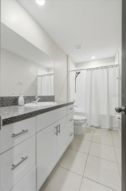 2175 Old Mining Road Lakeland, FL 33801 - Photo 27 of 51 a spacious bathroom with a granite countertop sink mirror and a toilet