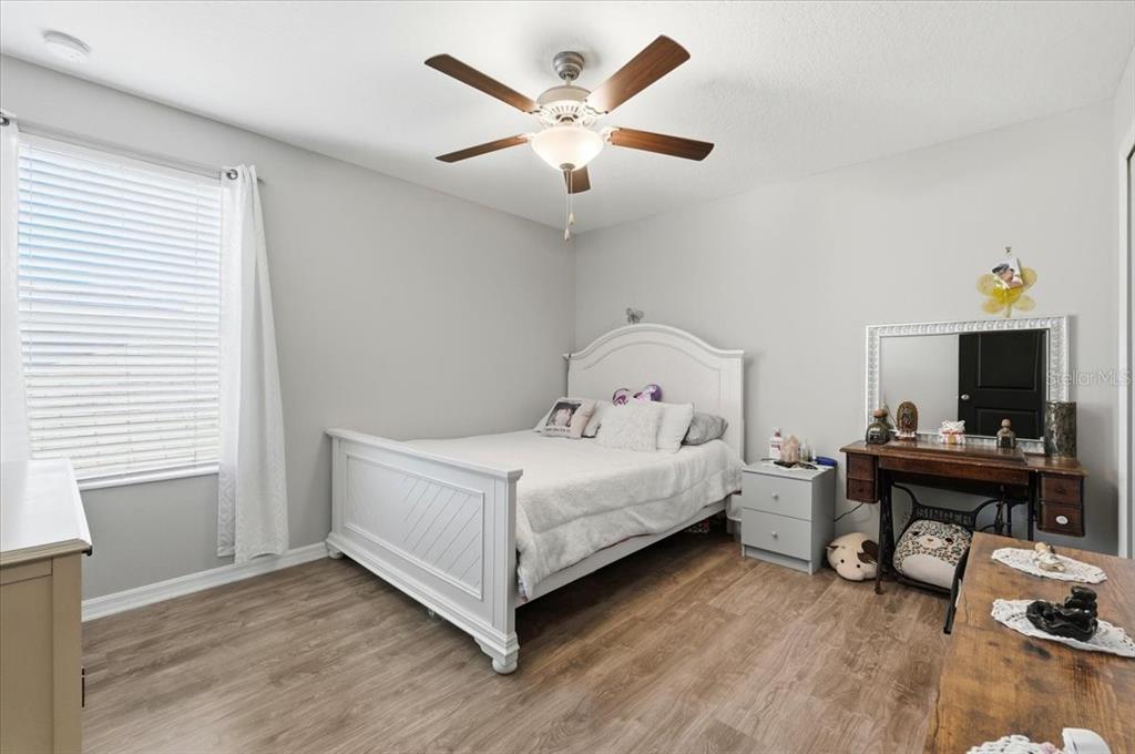 2175 Old Mining Road Lakeland, FL 33801 - Photo 30 of 51 a white bed sitting in a bedroom next to a window