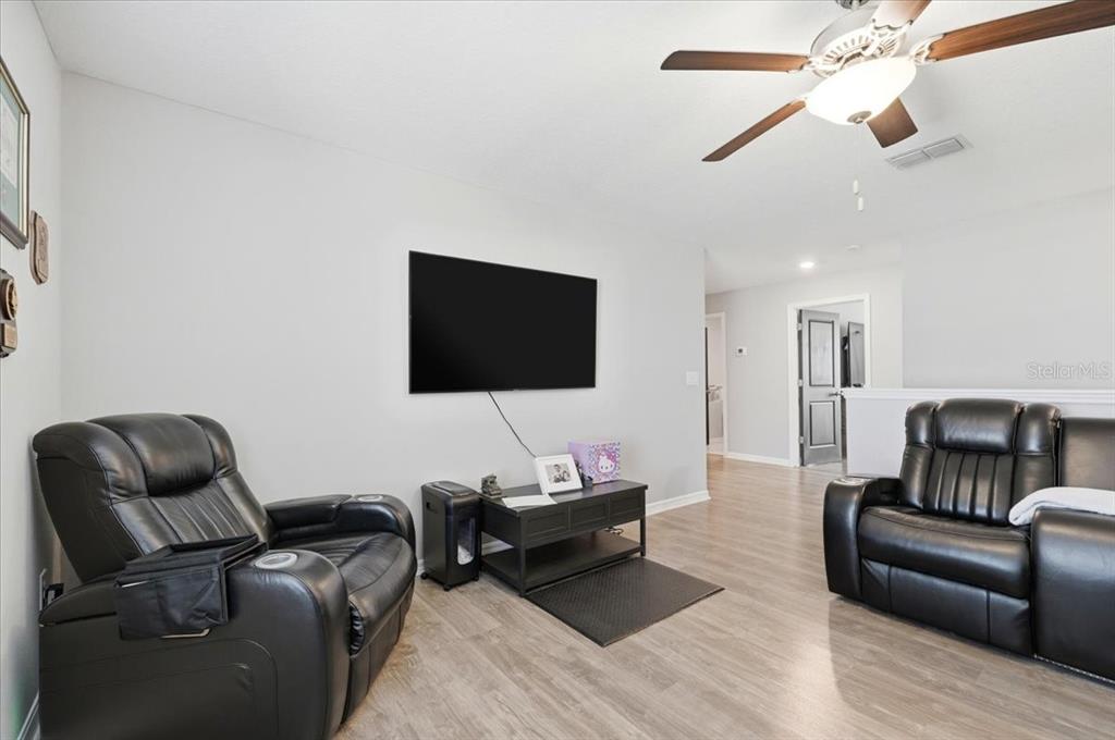 2175 Old Mining Road Lakeland, FL 33801 - Photo 34 of 51 a living room with furniture and a flat screen tv