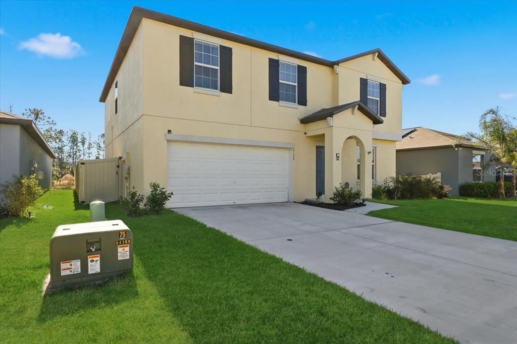 2175 Old Mining Road Lakeland, FL 33801 - Photo 44 of 51 a front view of a house with garden