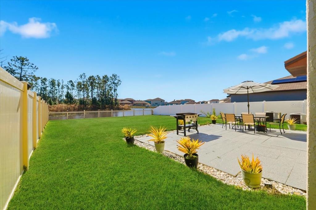 2175 Old Mining Road Lakeland, FL 33801 - Photo 5 of 51 a view of a swimming pool and lounge chairs in back yard of the house