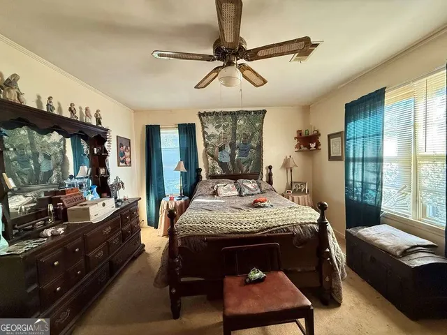 a view of a livingroom with furniture and window