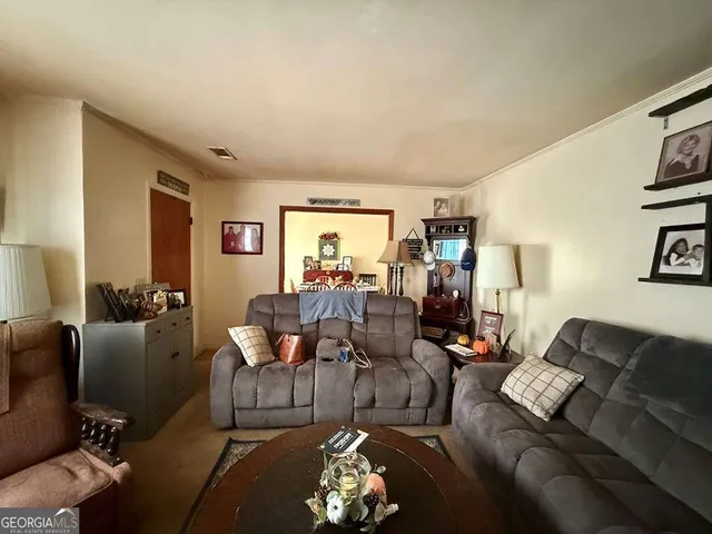 a living room with furniture window and wooden floor