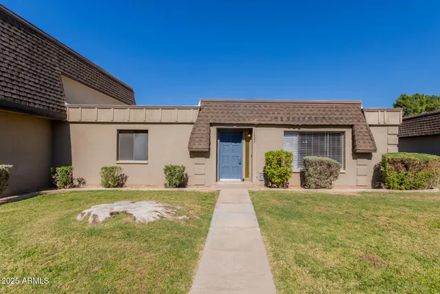 a front view of a house with a yard