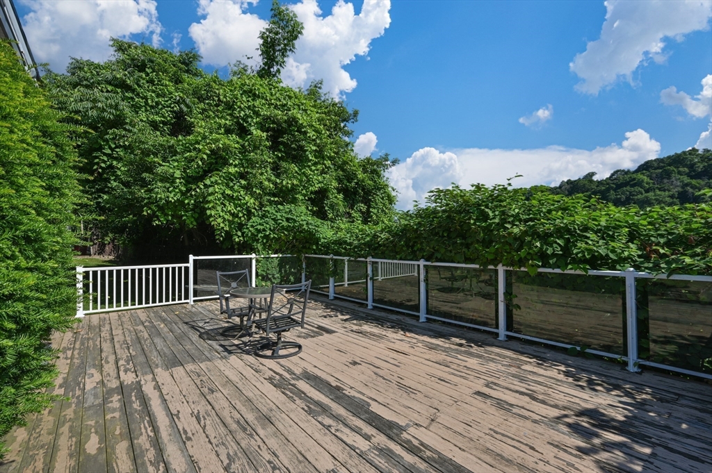 222 Stackpole Street, Unit 4 Lowell, MA 01852 - Photo 13 of 15 a view of balcony with deck and outdoor seating