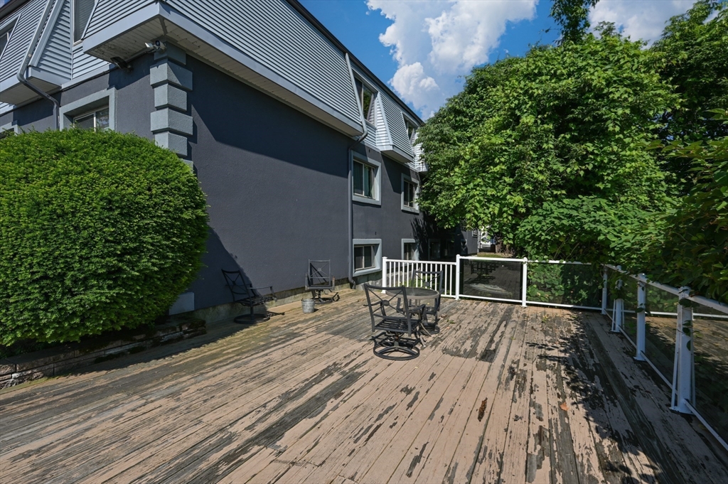 222 Stackpole Street, Unit 4 Lowell, MA 01852 - Photo 14 of 15 a view of a house with backyard and sitting area