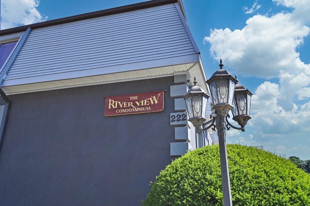 222 Stackpole Street, Unit 4 Lowell, MA 01852 - Photo 2 of 15 a front view of a house with garden