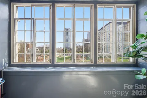 a view of lot of windows and hall with a large window